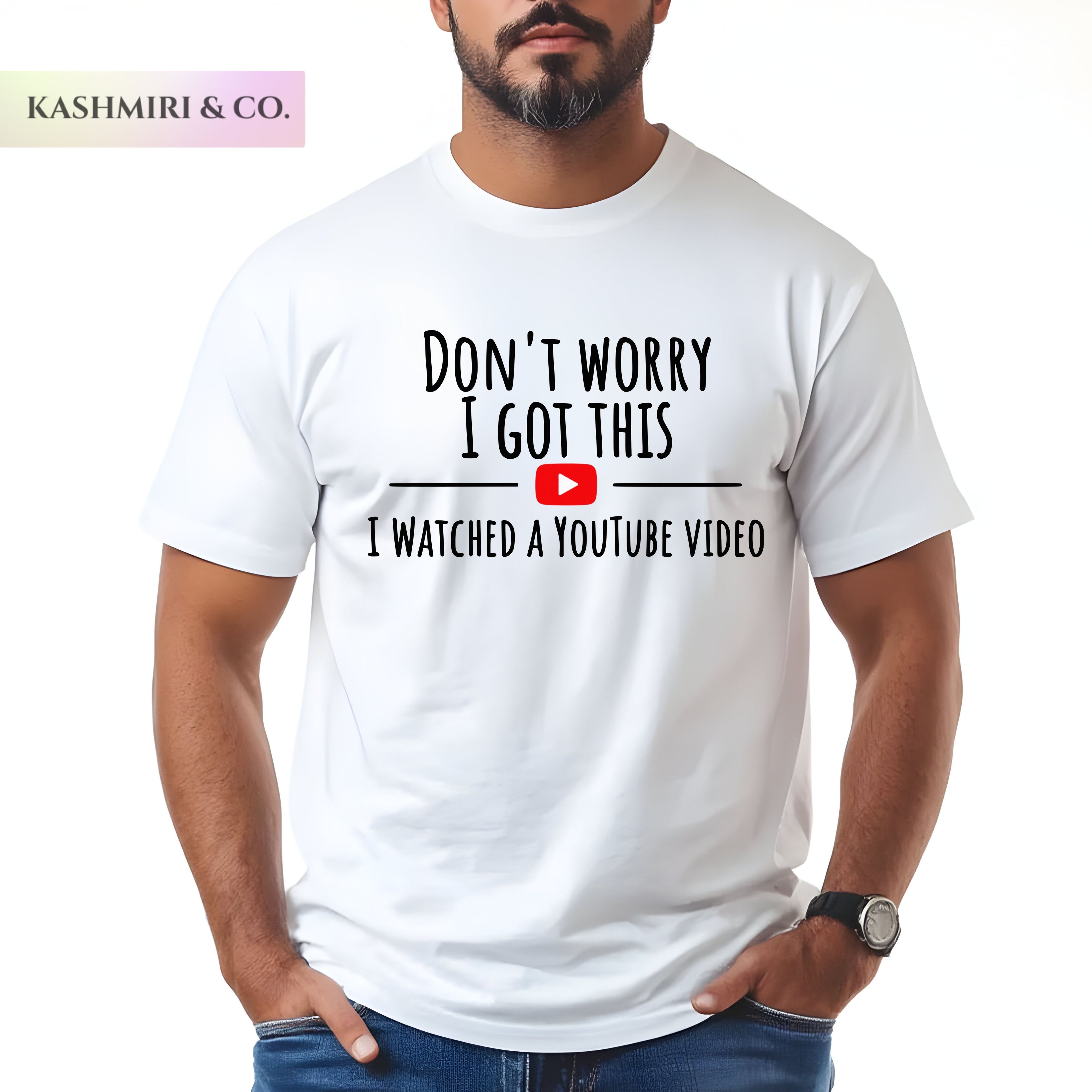 A man wearing a white graphic t-shirt with the text 'DON'T WORRY I GOT THIS I WATCHED A YOUTUBE VIDEO' and a red YouTube play button graphic. The brand name 'KASHMIRI & CO.